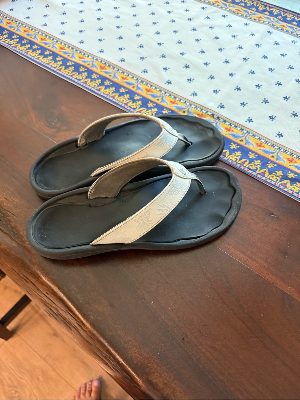 Olukai white flip-flops with pineapples